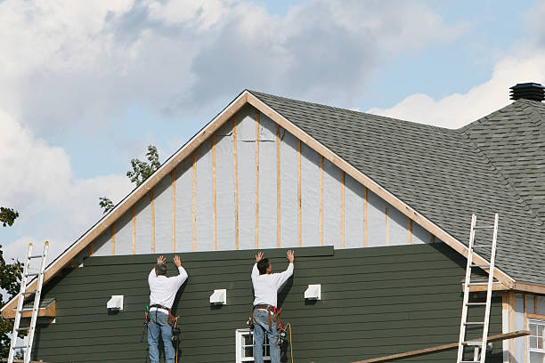 Professional Storm Damage Siding Repair technician working in Rossiter, PA